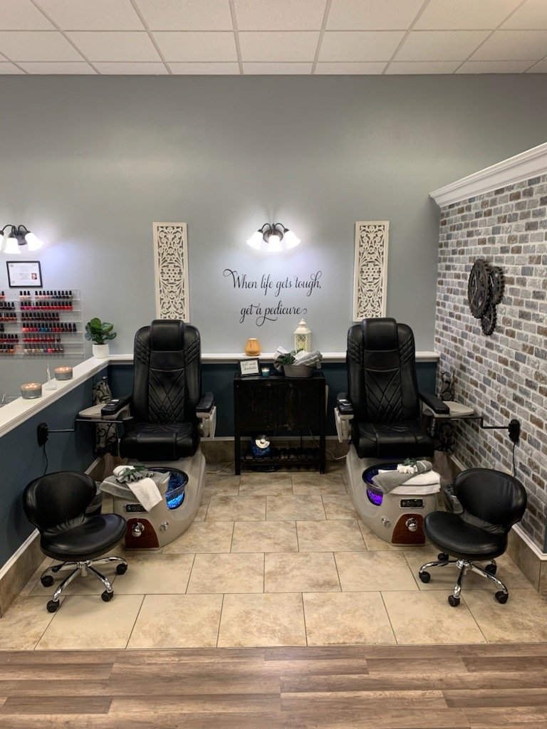 Hair styling station with salon chairs and mirrors.